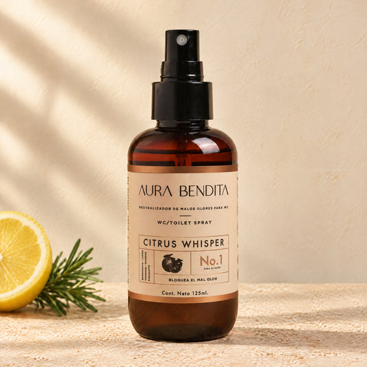 Citrus Whisper de Aura Bendita sobre piedra con luz cálida de tarde